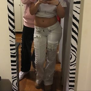 White (now slightly pink) buckled flare pants